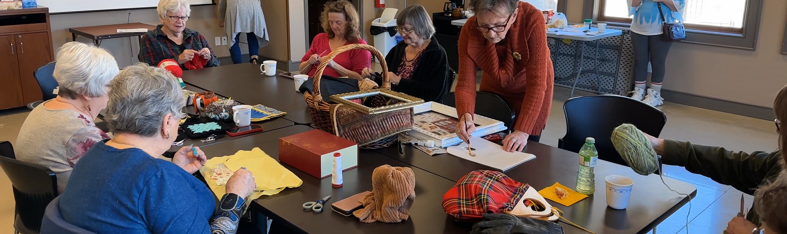 A picture of a group of ladies crafting at the Brussels Library.