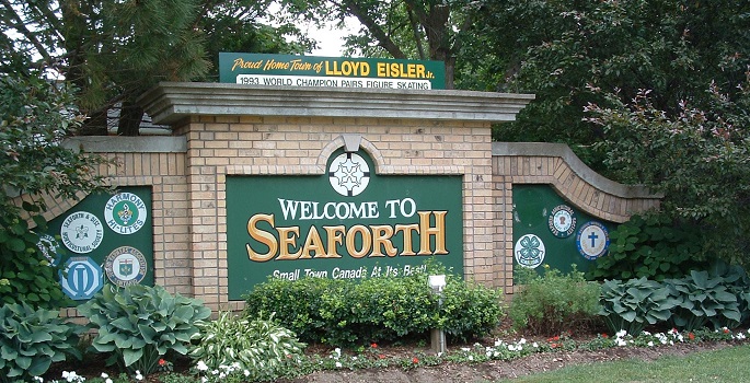 Welcome to Seaforth Sign , brick wall with flowers 