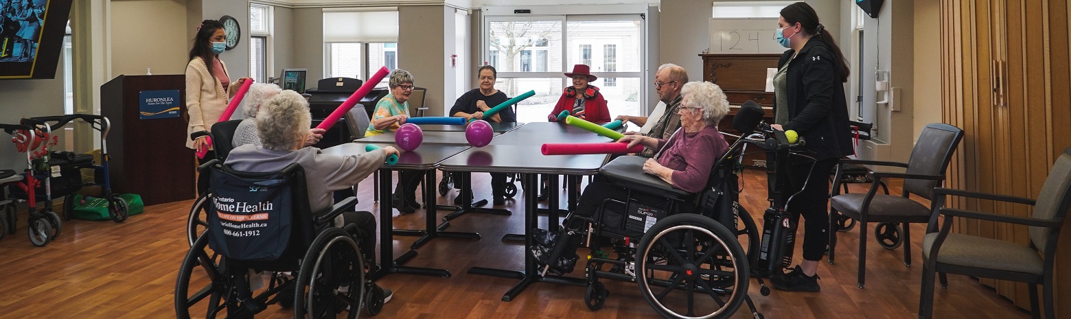 Seniors engaging in an activity at a long-term care home.