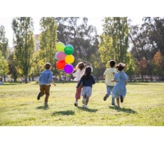 Kids Playing outside with balloons