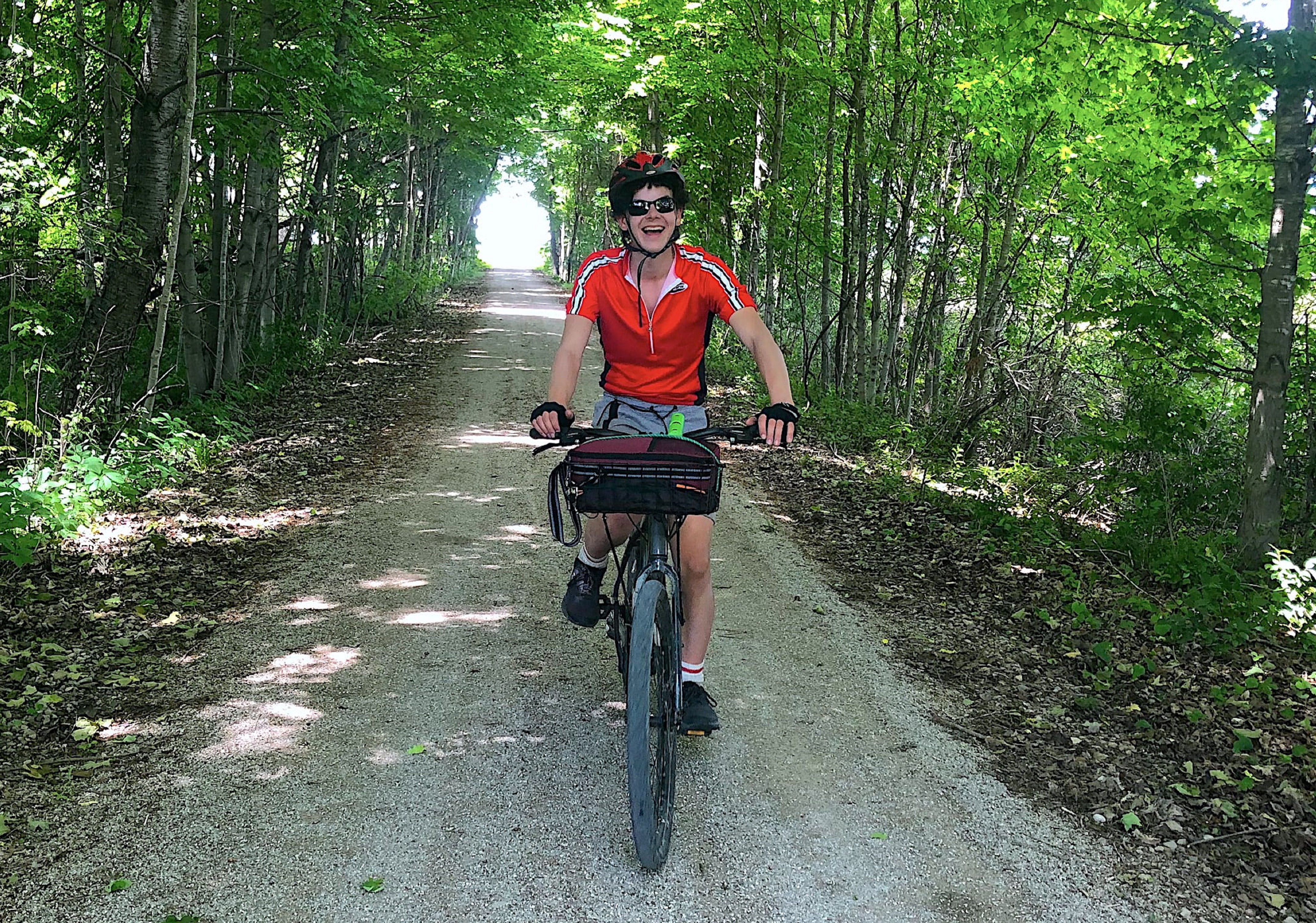A picture of a woman cycling on the G2G Trail.