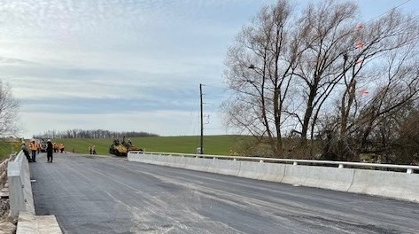 newly constructed Kinburn Line Bridge with construction workers in the backgroud