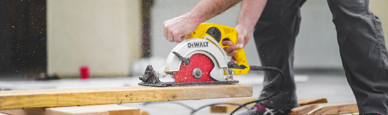 Man cutting wood with circular saw