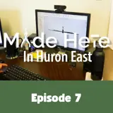 [A photo of a computer showing an industrial ceiling fan on the screen captured from Episode 7 of the Made Here in Huron East video series.]